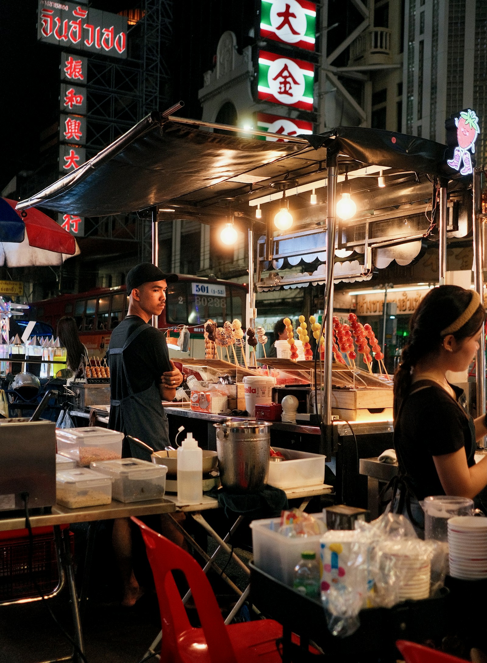 A Bangkok Chinatown street-food stall lit by neon at night